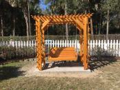 Click to enlarge image The lattice adds a bit of pizazz and the framework for climbing jasmine and roses.(Trellis Swing and Frame:$1457 for standard 4'-$100 each additional foot up to 6') - Adirondack Style Furniture - How it all started